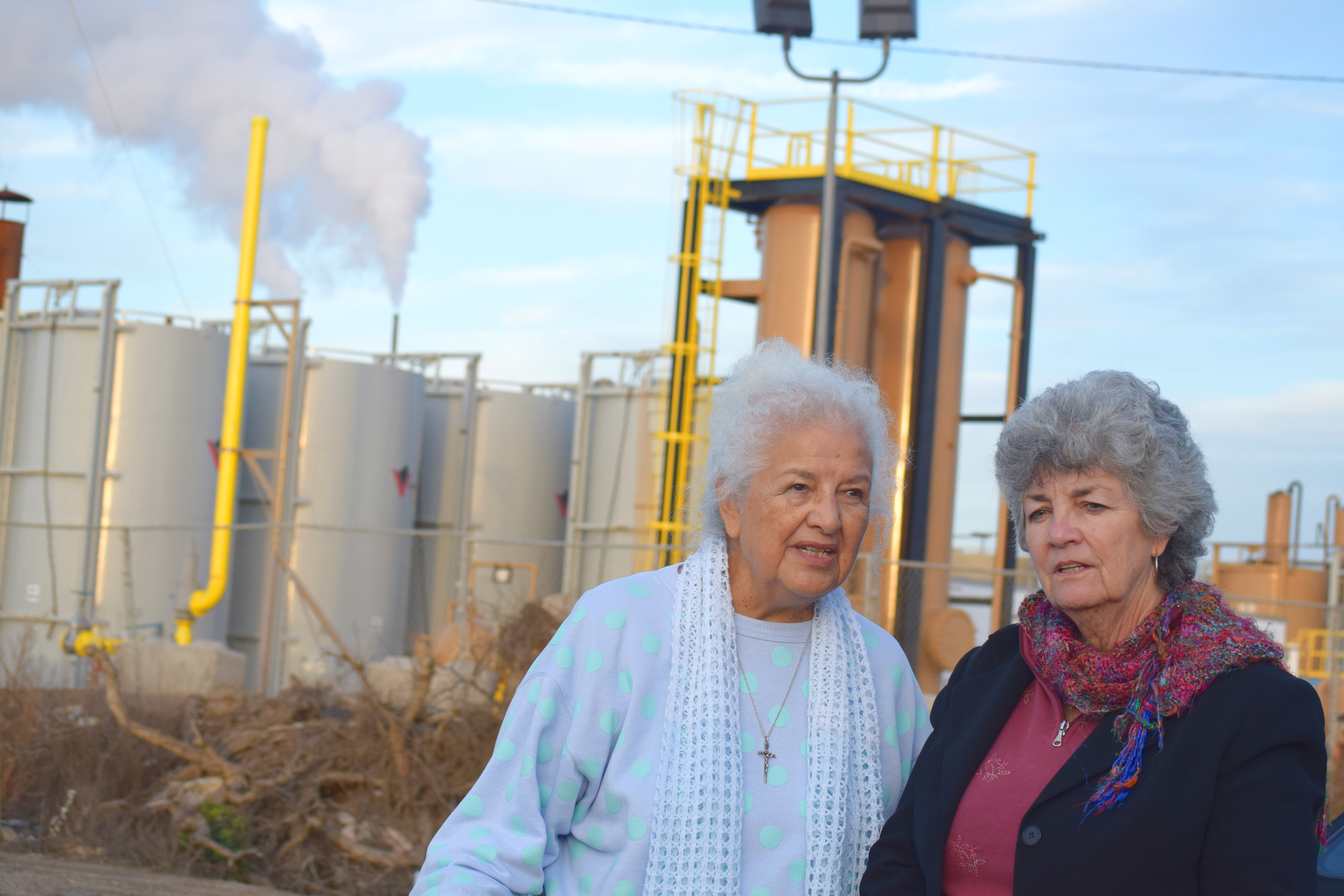 Activist Lupe Anguiano, left, and Councilwoman Carmen Ramirez stand near tanks of steam. (Photo by Elaine Fragosa)